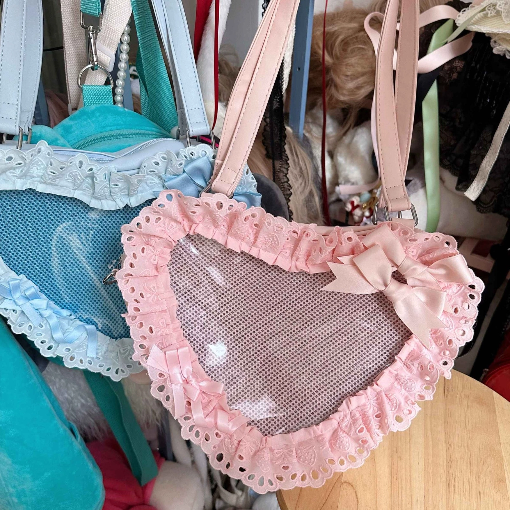 sweet lolita heart bag with lace-up details cross-lace trim front panel close-up photography