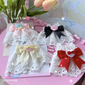 sweet lolita heart lace wrist cuffs with satin bows flat lay styled with pink tulips and pastel background