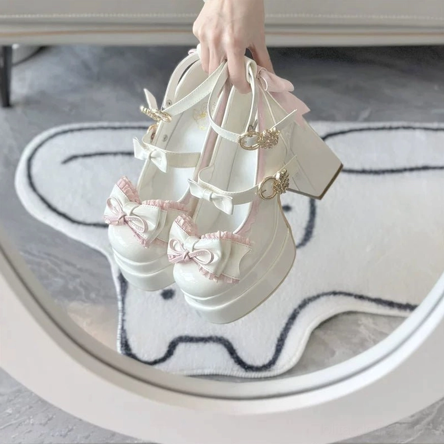 Sweet Lolita platform heel shoes detailed close-up of decorative bow and ruffle embellishments on shoe upper