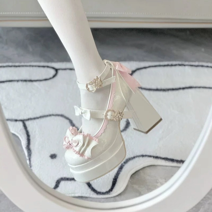 Sweet Lolita round toe platform heels close-up of glossy patent leather upper with bow and ruffle trim details