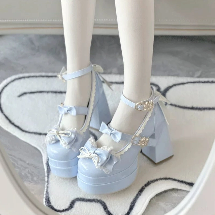 Sweet Lolita patent leather platform heels close-up of decorative metal buckle and ankle strap attachment