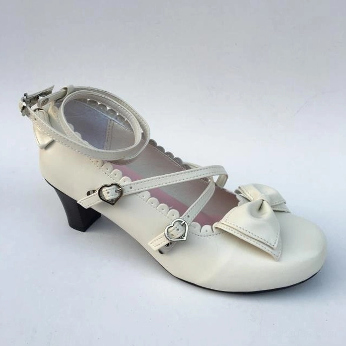 Sweet lolita handcrafted heels showcasing premium PU leather construction, heart-shaped buckle fastening system, rounded scalloped toe design, and block heel profile