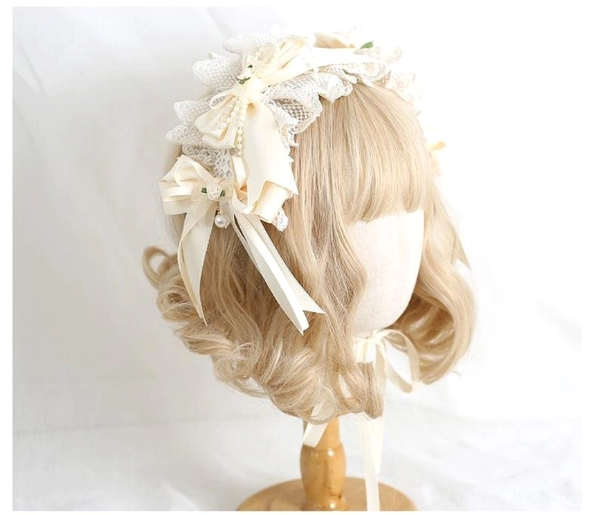 Sweet lolita lace flower bow headwear worn on blonde curly wig showing beige ivory frilled design