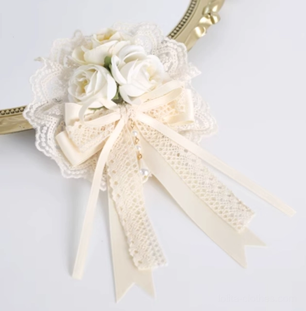Large ivory fabric flower lace bow hair clip with layered rose blooms and ribbon tails with pearl pendants