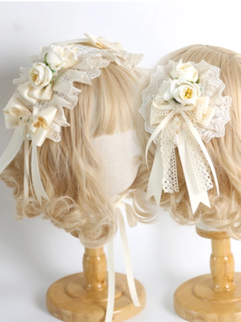 Two styles of ivory sweet lolita hair ornaments displayed on mannequins with rose flower set and bow designs