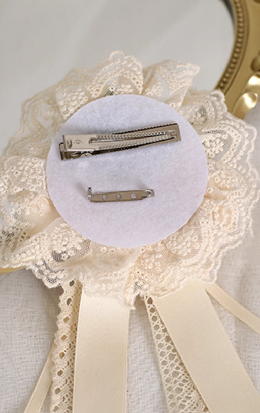 Close-up detail of sweet lolita ivory lace texture and satin bow ribbon construction quality