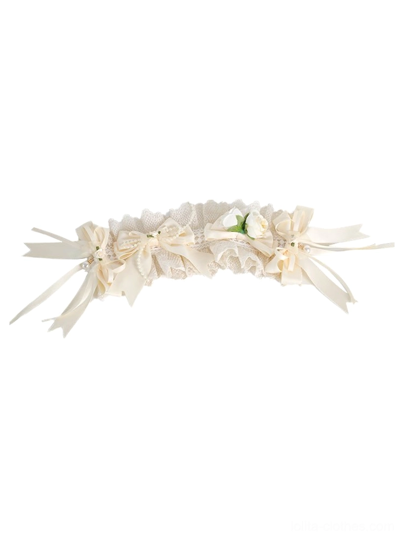Ivory lace curved sweet lolita headband with multiple bow and floral embellishments front view