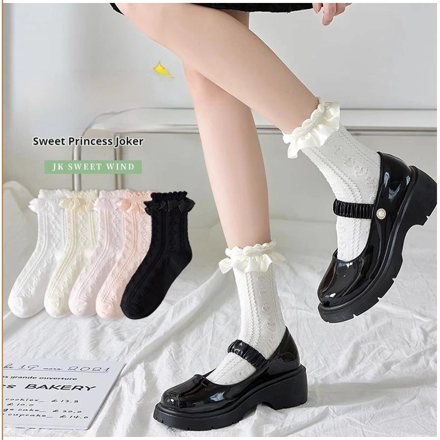 Sweet Princess JK Lolita mid-calf socks with ruffled ankle cuffs displayed on-leg with black platform Mary Jane shoes double view on white bedding