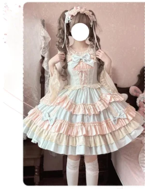 Back half-body mirror view of sweet lolita jumper skirt showing tiered ruffles with lace trim, decorative skirt bows, and adjustable back straps, styled with white knee-high socks in bedroom setting