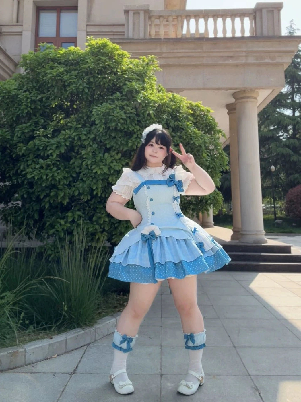 Sweet Lolita dress styling with complementary accessories and props showing complete aesthetic vision, plush toys, furniture styling, coordinate photography inspiration