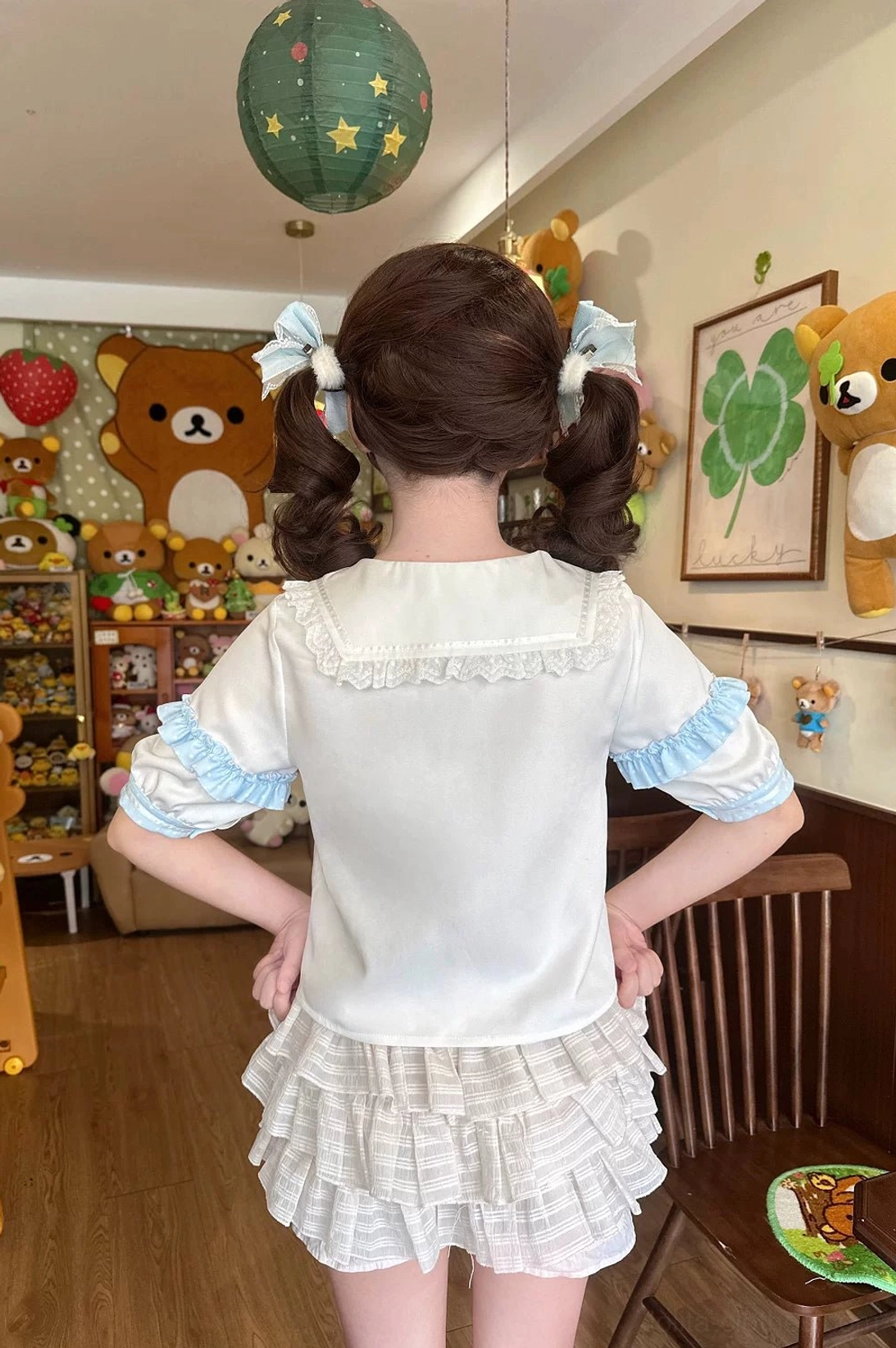 Lolita JSK dress set ensemble all pieces laid flat display showing complete coordinate components including dress, blouse, hat, leg warmers, trailing bow, and coordinating accessories
