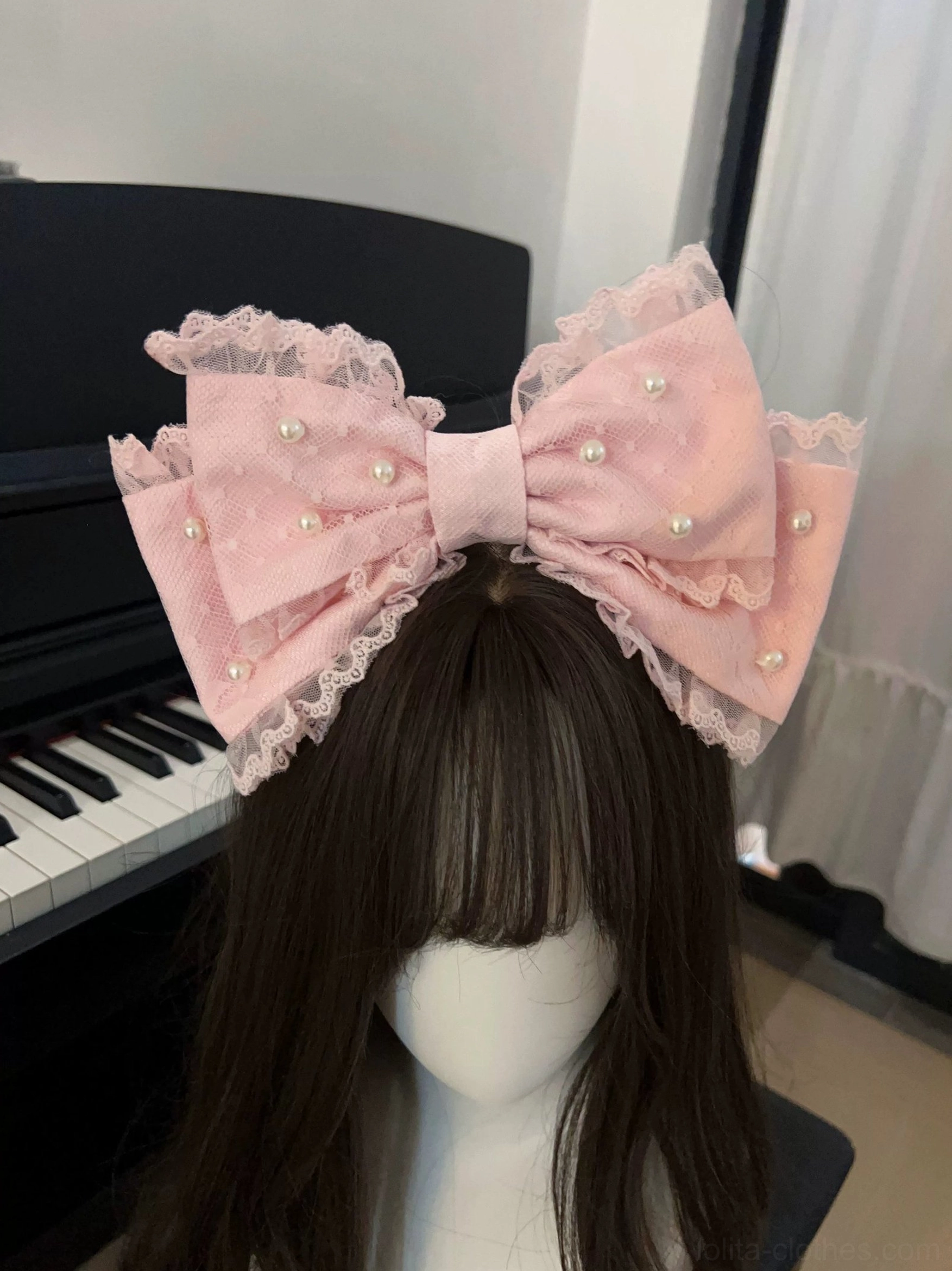 Sweet Lolita JSK dress with coordinating bow detail showing accent piece placement and decorative emphasis