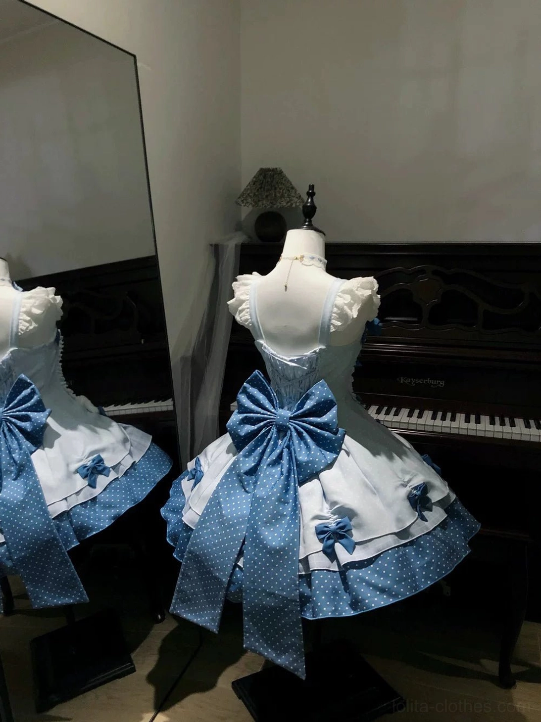 Sweet Lolita JSK dress detail shots showing lace-up corset bodice front, ruffled shoulder straps, oversized polka dot bows, layered construction elements