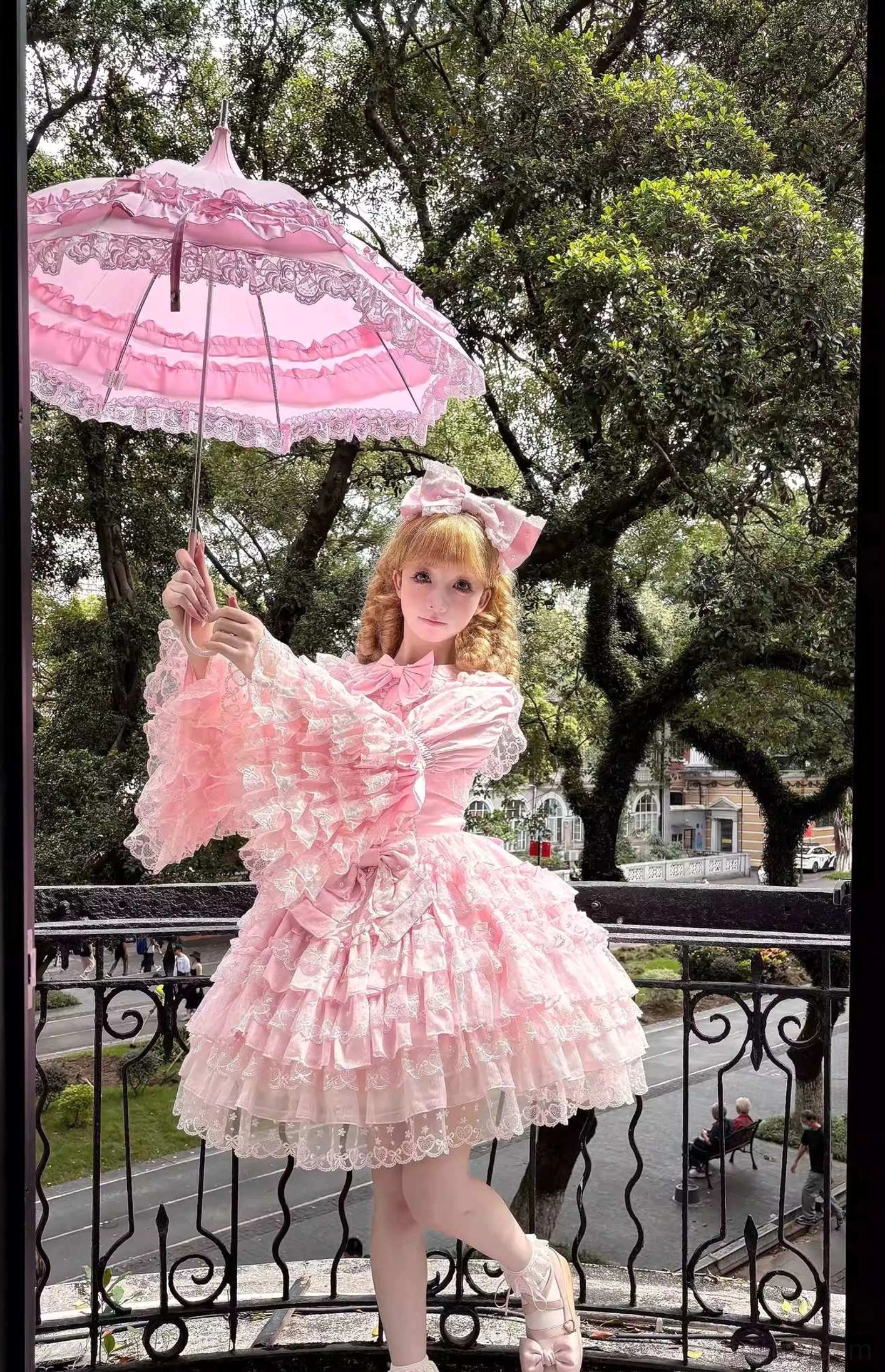 Sweet Lolita JSK dress detail shot showing tiered ruffle construction, heart lace motifs, and layered dimensional volume of hem