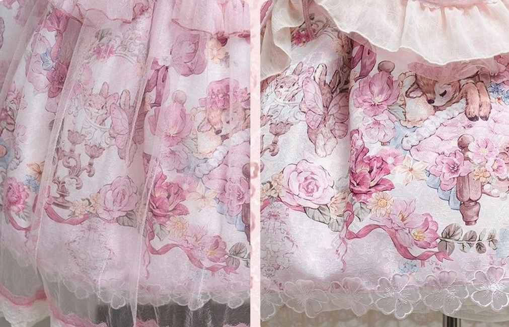 Close-up fabric texture of sweet lolita JSK dress showing intricate pink rose and deer vintage print pattern layered tulle overlay lace trim