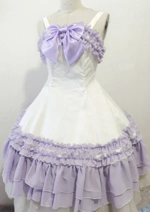 Sweet lolita JSK dress front view showcasing oversized satin bow, tiered ruffled skirt hem, and graceful paneled silhouette in multiple colorways including black and pink, white and green, lavender, and white base options