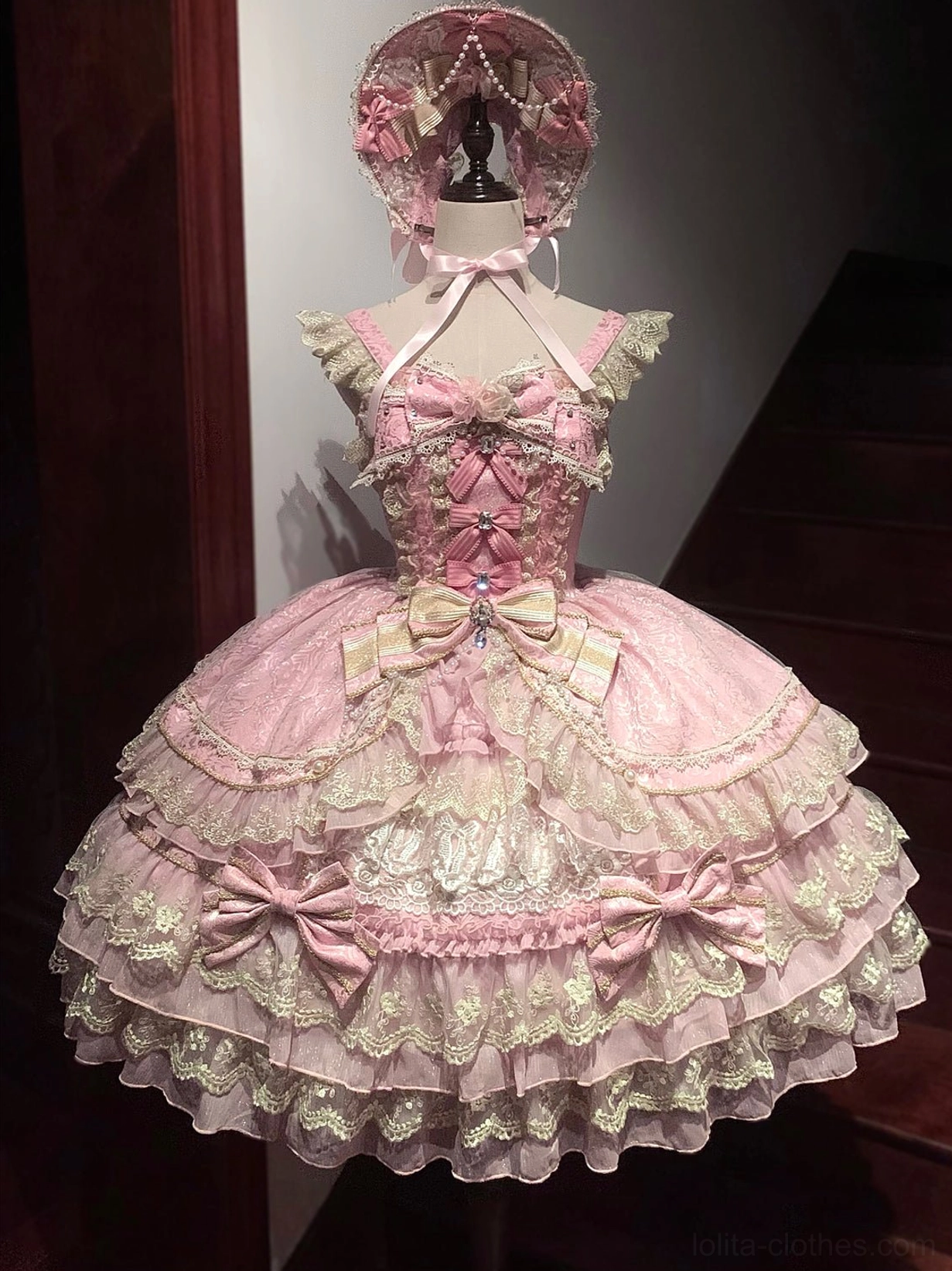 Sweet lolita JSK front view detail showing bead chain decoration and rhinestone accents on bodice