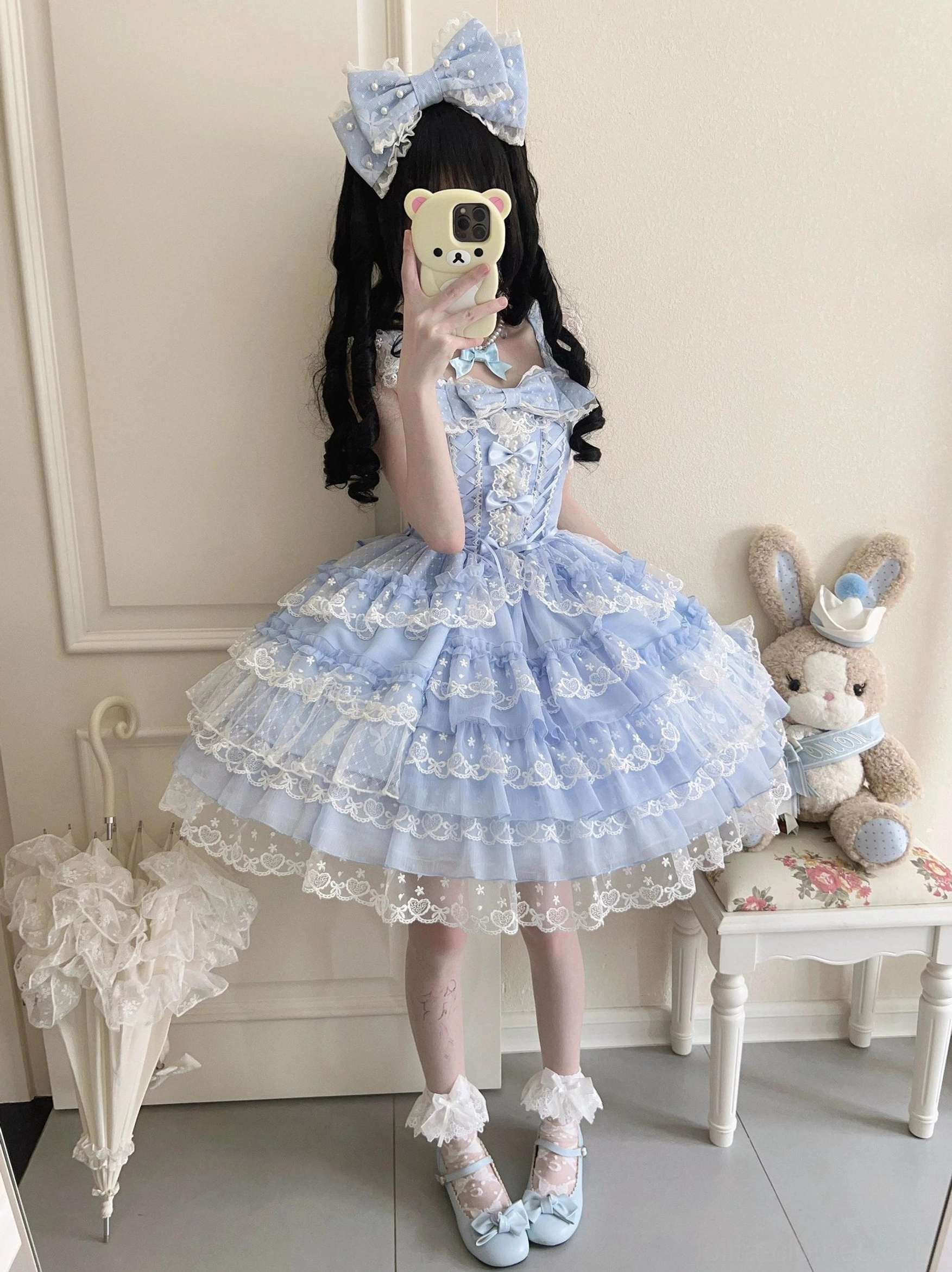 Sweet Lolita jumper skirt front panel detail showing heart lace pattern, tiered ruffle arrangement, and lace density