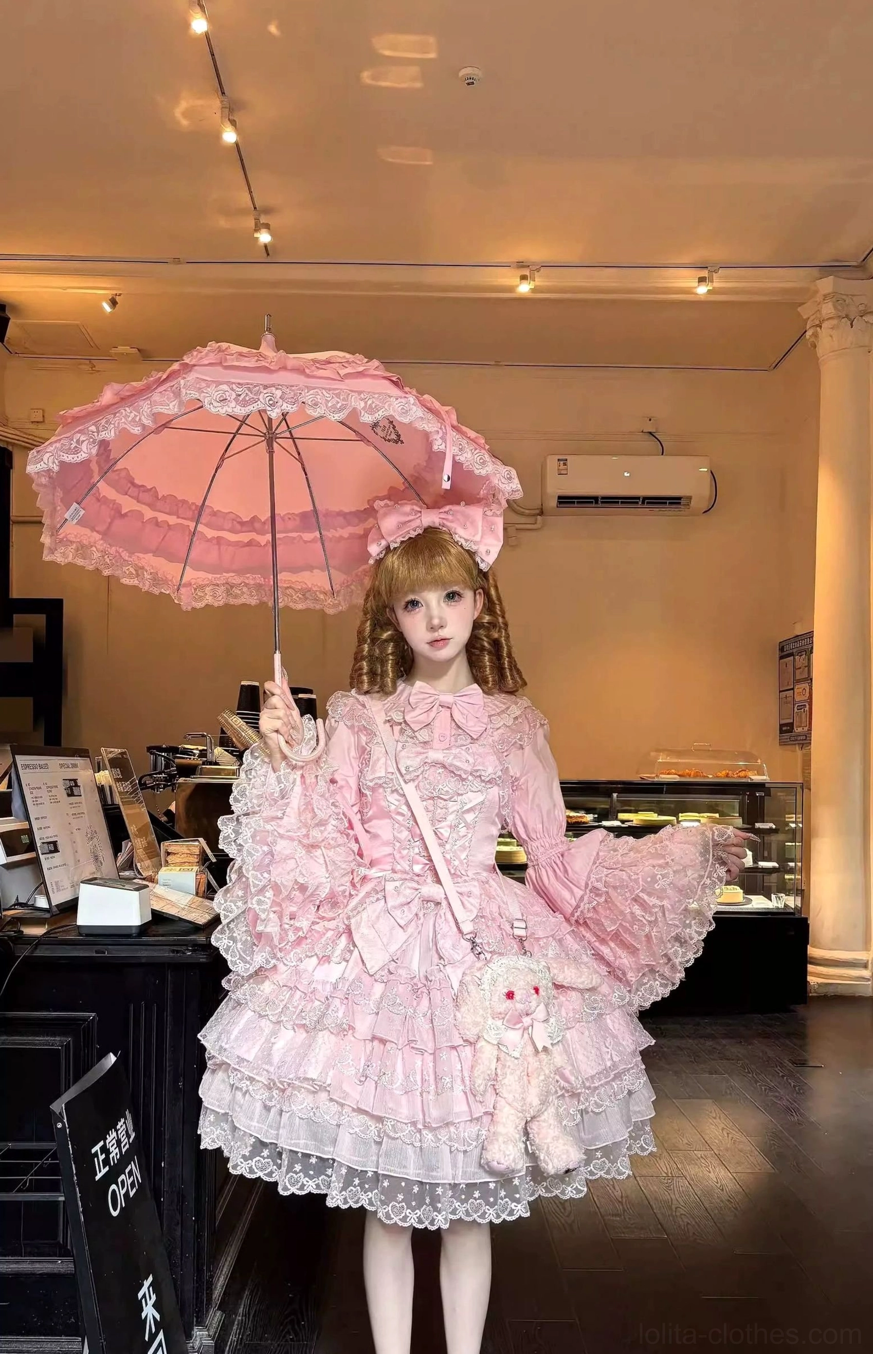 Sweet Lolita JSK dress modeling shot showing full outfit with coordinating petticoat, inner blouse, socks, and shoes styling
