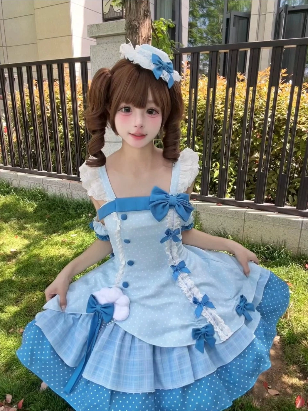 Lolita dress and matching hat coordination close-up showing color harmony, polka dot pattern matching, bow details, and complete set cohesion design aesthetic