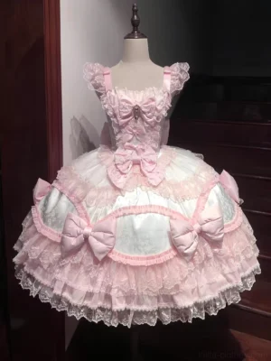 Pure pink and white sweet lolita jumper skirt dress featuring layered ruffled lace trim, satin bows, and sweetheart neckline on mannequin