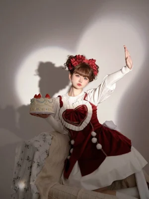 Sweet lolita jumper skirt three quarter side sitting view red velvet lace-up back design fitted silhouette