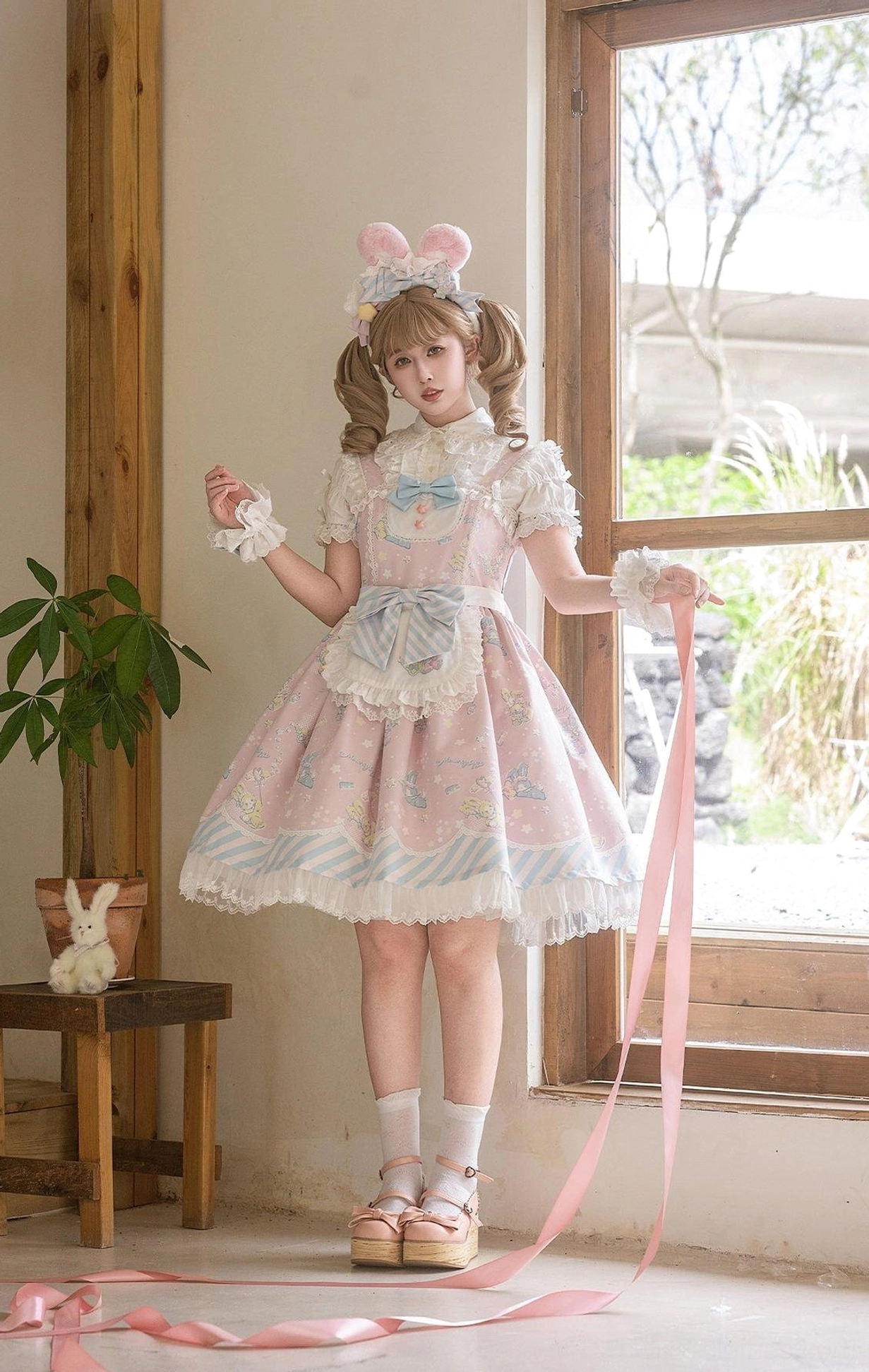 Sweet Lolita jumper skirt size comparison showing S M L sizing on dress forms or flat lay displaying size progression