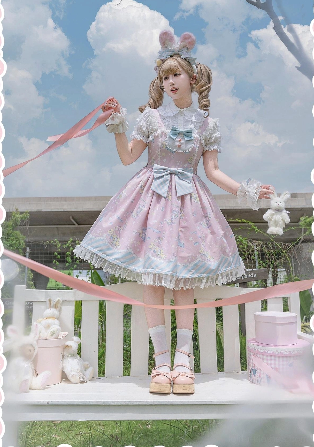 Sweet Lolita jumper skirt waist and lace hem detail showing elastic waistband construction, striped lace edge trim, and bowknot waist decoration