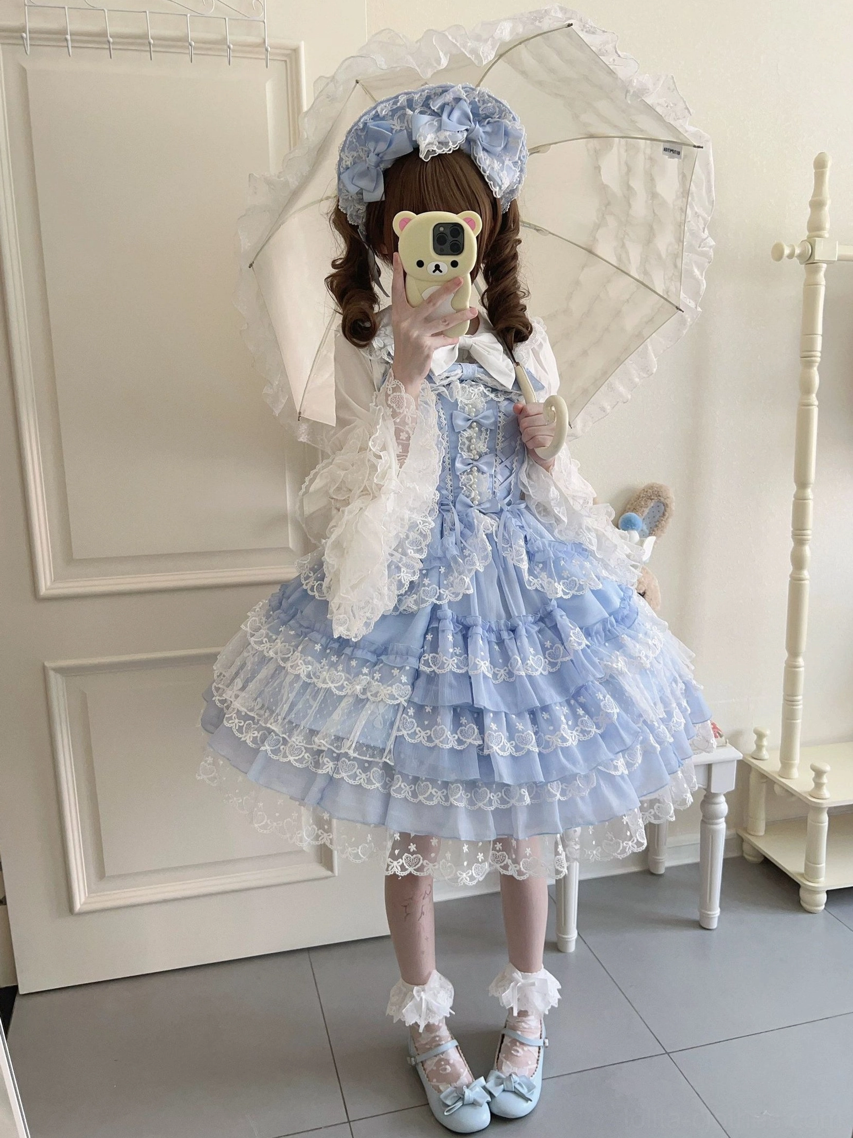 Sweet Lolita jumper skirt waist area showing lace-up back system, shirring construction, and waist bow placement for silhouette customization