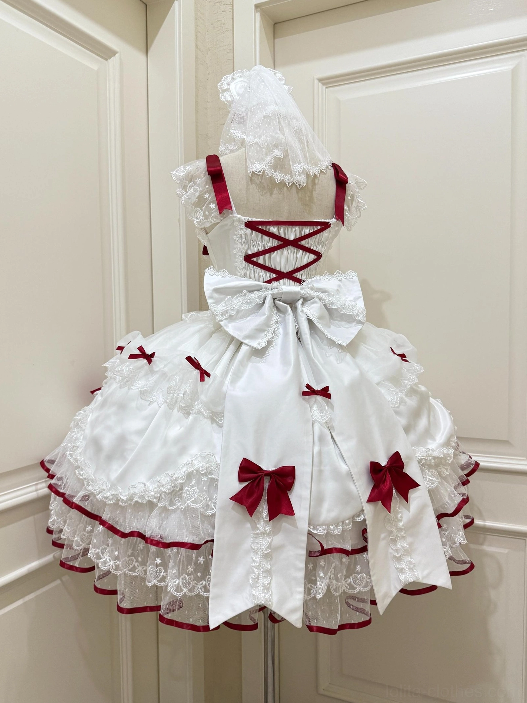 Sweet Lolita JSK jumper dress back view white-red cross lace-up large satin bow red satin decorations dress mannequin