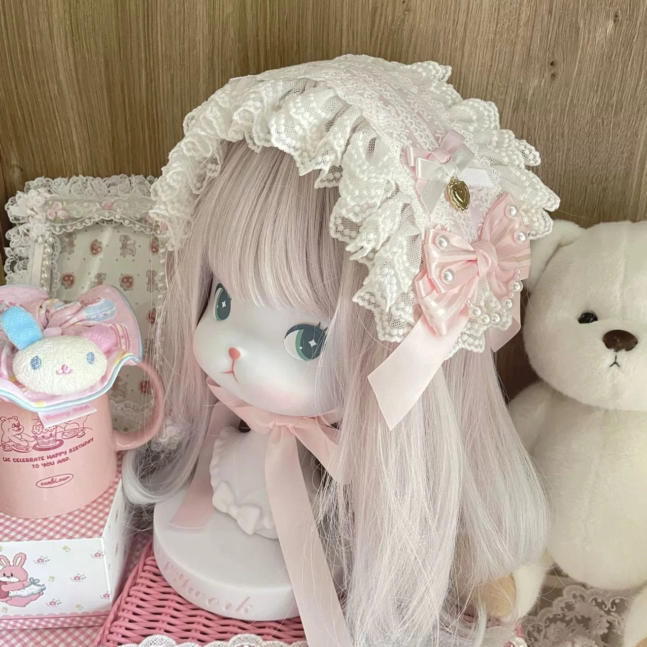 Sweet Lolita lace bonnet hairband with white ruffled lace trim, pink satin bows, faux pearls and gold heart charm details, handmade headdress front three-quarter view