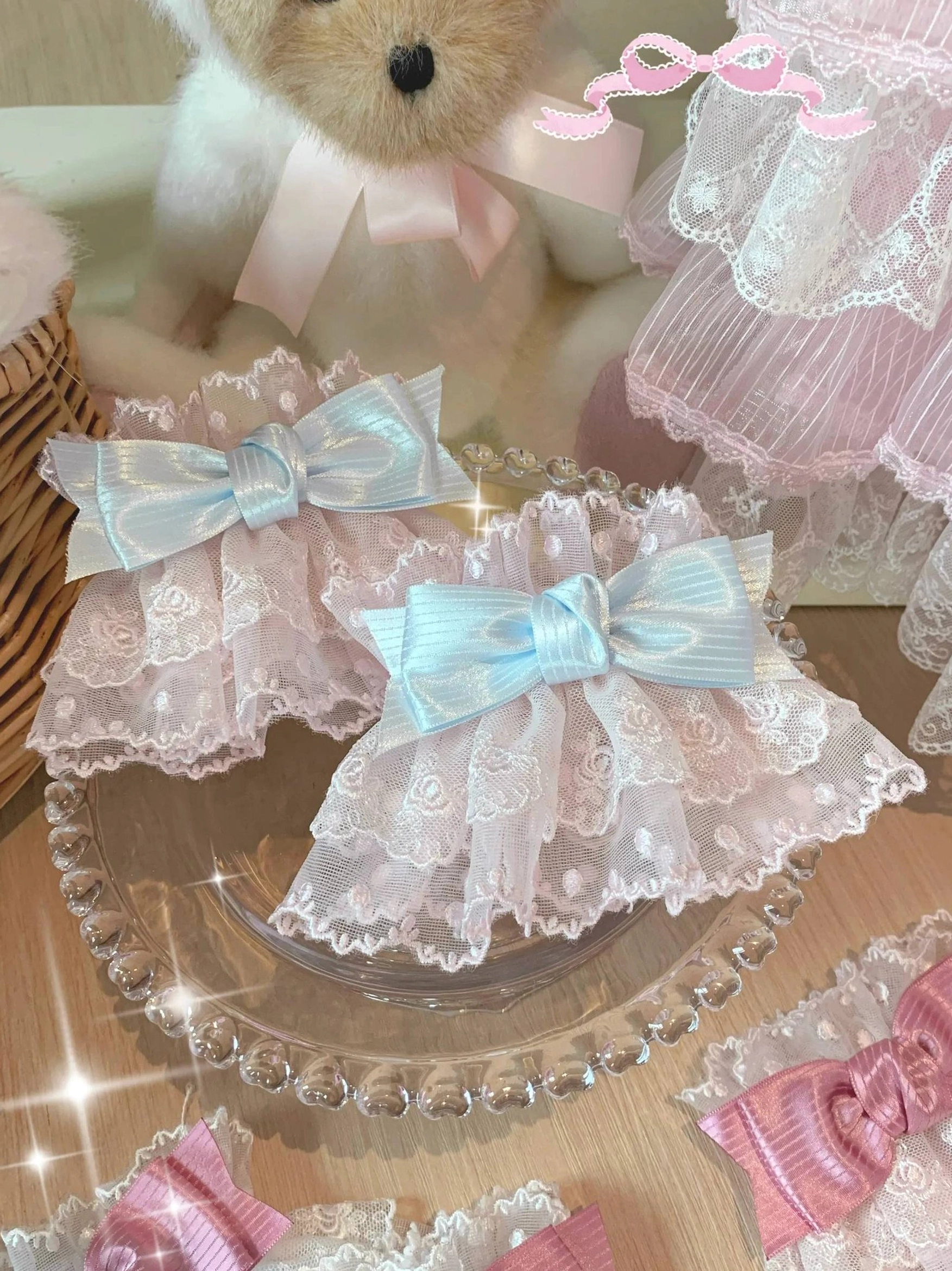 Lolita lace bow wrist cuffs oblique overhead display with blue and pink color options showing layered lace ruffles and multiple cuff presentation