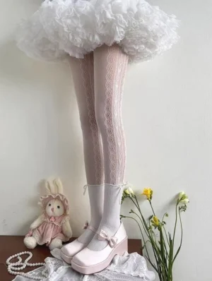Sweet lolita heart lace patchwork pantyhose white color front low-angle close-up worn with white ruffled skirt and pink platform mary jane shoes cute aesthetic