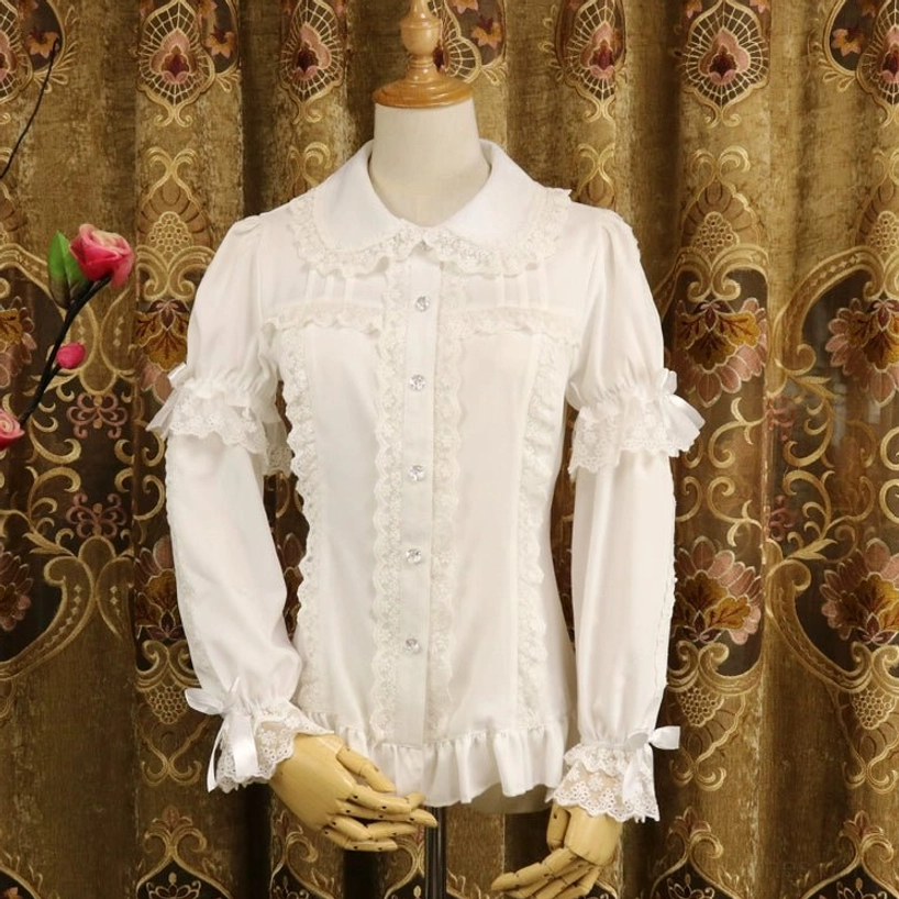 Milk white long-sleeve sweet lolita chiffon blouse with Peter Pan collar, front button closure with lace panels, lace-trimmed cuffs and bow details