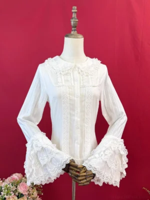 Sweet lolita white long sleeve cotton shirt with Peter Pan collar, double-layer ruffled bell sleeves, and delicate lace front placket displayed on dress form