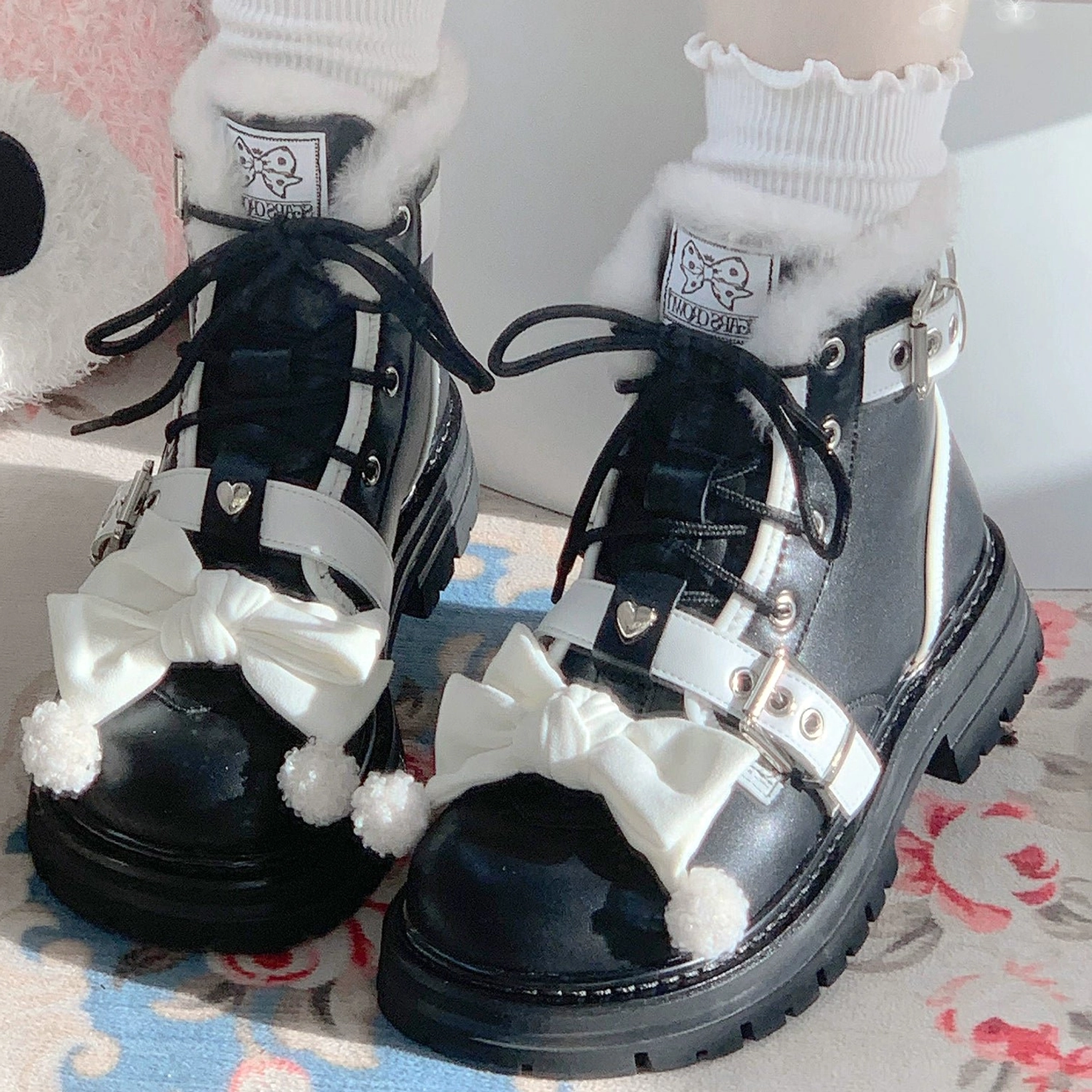 Sweet lolita winter martin boots black leather round toe white bow pom-pom decorative heart buckle overhead front view indoor