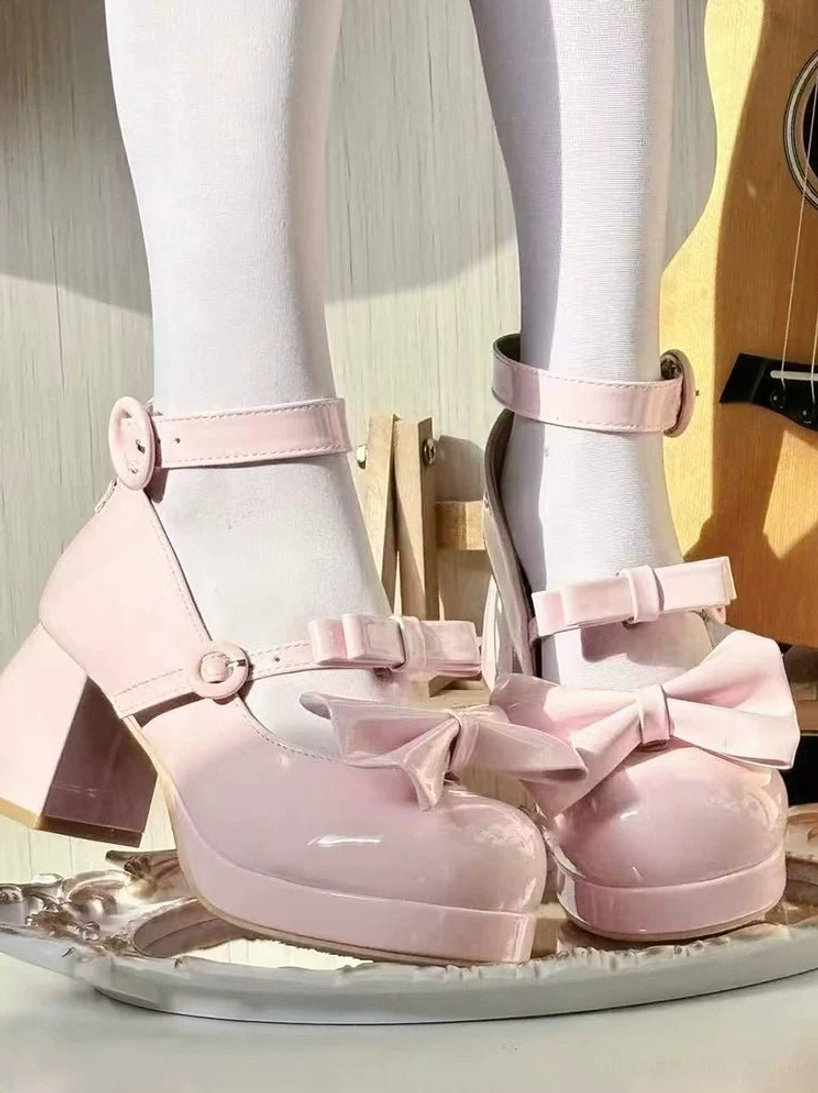 Sweet lolita chunky heel mary jane shoes pink patent leather worn on feet with white sheer stockings guitar backdrop