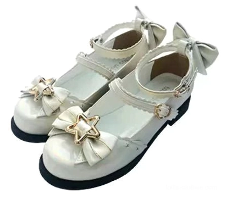 Front-on flat lay display of cream white sweet lolita mary jane shoes on plain white background showing back heel bow front star ornament ankle buckle strap and black rubber sole