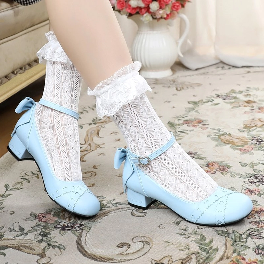 Sweet lolita Mary Jane round toe flat shoes rear view showing ankle strap with decorative bow and heel construction from back perspective