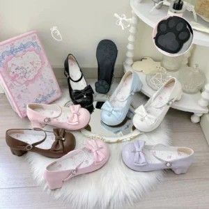 Assorted sweet lolita round toe Mary Jane shoes collection with multiple colorways including purple glossy patent leather, pink patent finish, and brown matte options, displayed on white fur rug with branded packaging and accessories, showcasing cat paw heel details and decorative bell bows