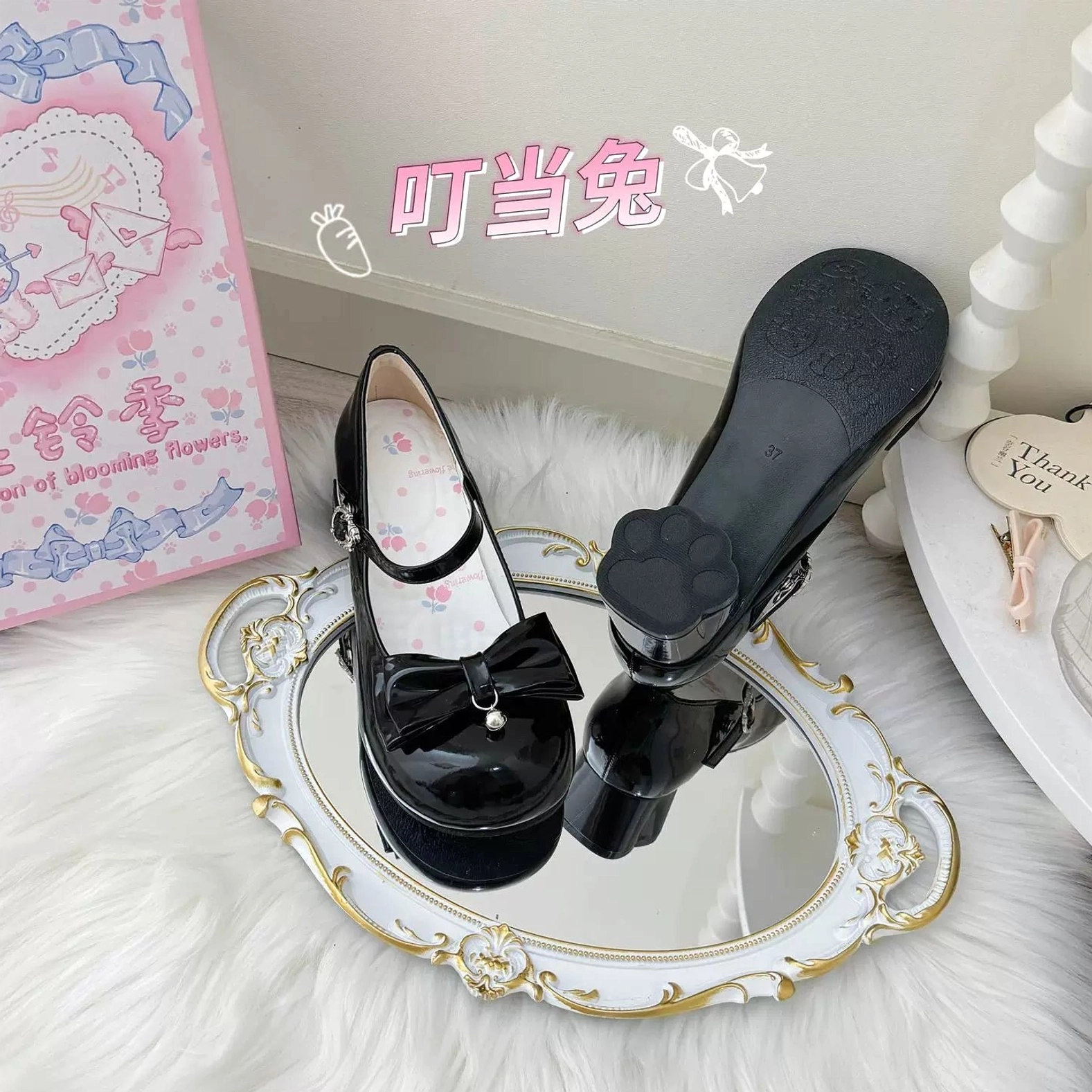 Bundle view of glossy patent finish and matte oil finish sweet lolita Mary Jane heels in multiple colorways including purple and brown options, showing variations in heel finish and surface texture, bunny-shaped buckle details, and bell-adorned toe bows across the collection