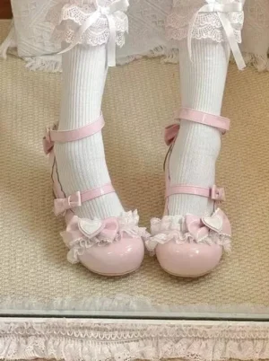 Close-up overhead view of sweet lolita mary jane heels on model wearing ruffled white knee-high socks with dual ankle straps and mid-height block heel design