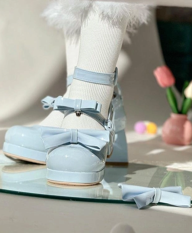Light blue smooth leather sweet lolita heel shoes worn on feet side three-quarter view with white fuzzy trim socks