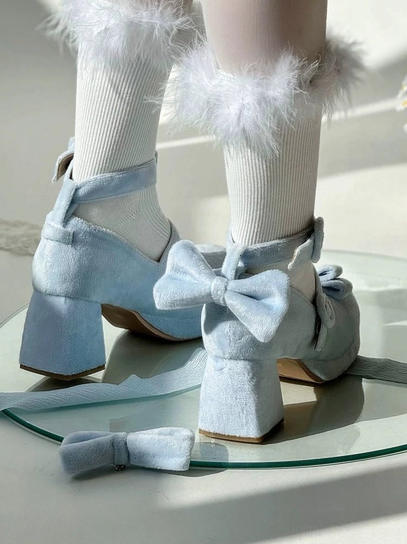Light blue velvet sweet lolita mary jane heel shoes displayed on glass tray with detachable bow and white fuzzy socks