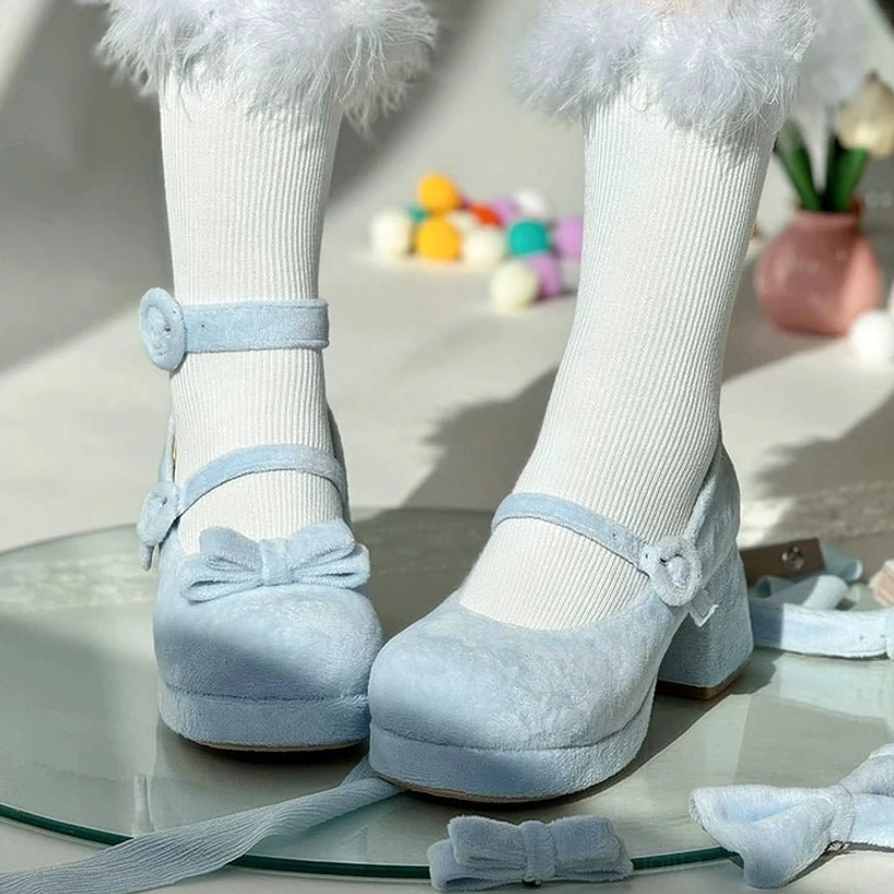 Light blue velvet sweet lolita chunky platform heel mary jane shoes worn on feet with white fuzzy socks ornaments