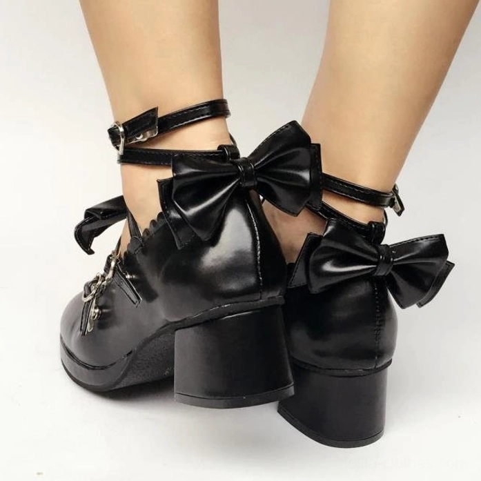 Detailed side profile of sweet Lolita Mary Jane platform shoe highlighting crisscross strap weaving, decorative bows, and block heel proportions