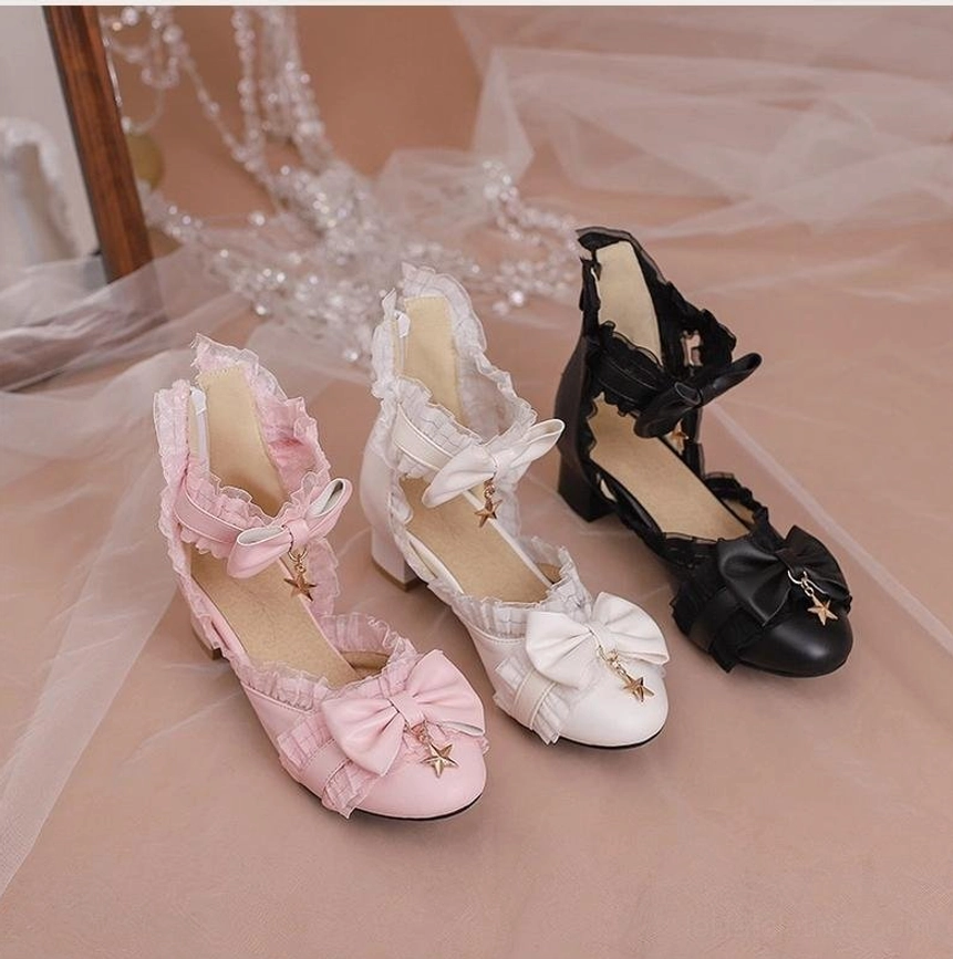 Flat lay product display of Sweet Lolita Mary Jane shoes in three color variants pink ivory black showing star charm bows ruffled lace and block heel