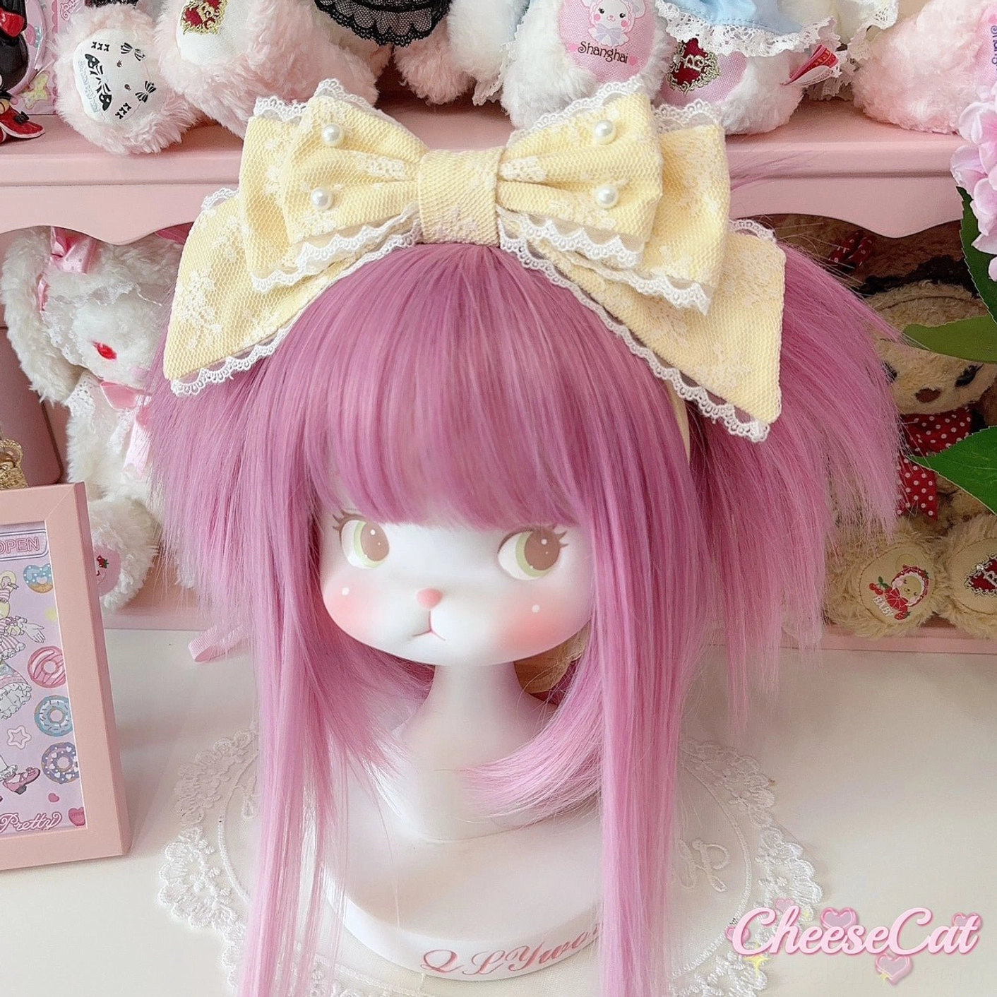 Milk yellow sweet lolita pearl-embellished KC headband with white lace trim bow displayed on pink mannequin with plush toy backdrop