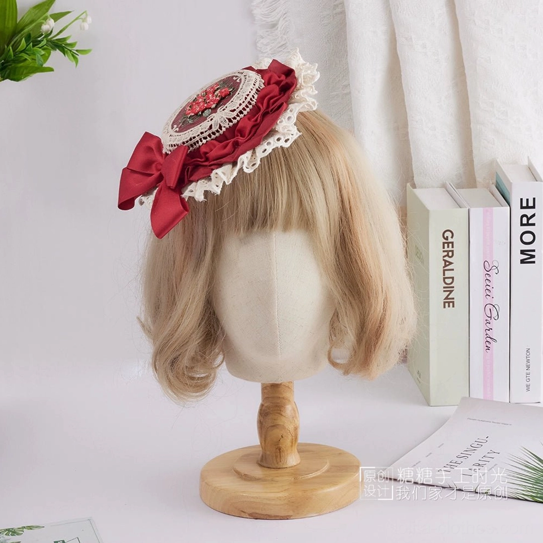 Vintage-inspired Sweet Lolita top hat with burgundy red satin bow, intricate red berry floral embroidery centerpiece, and refined white lace detailing