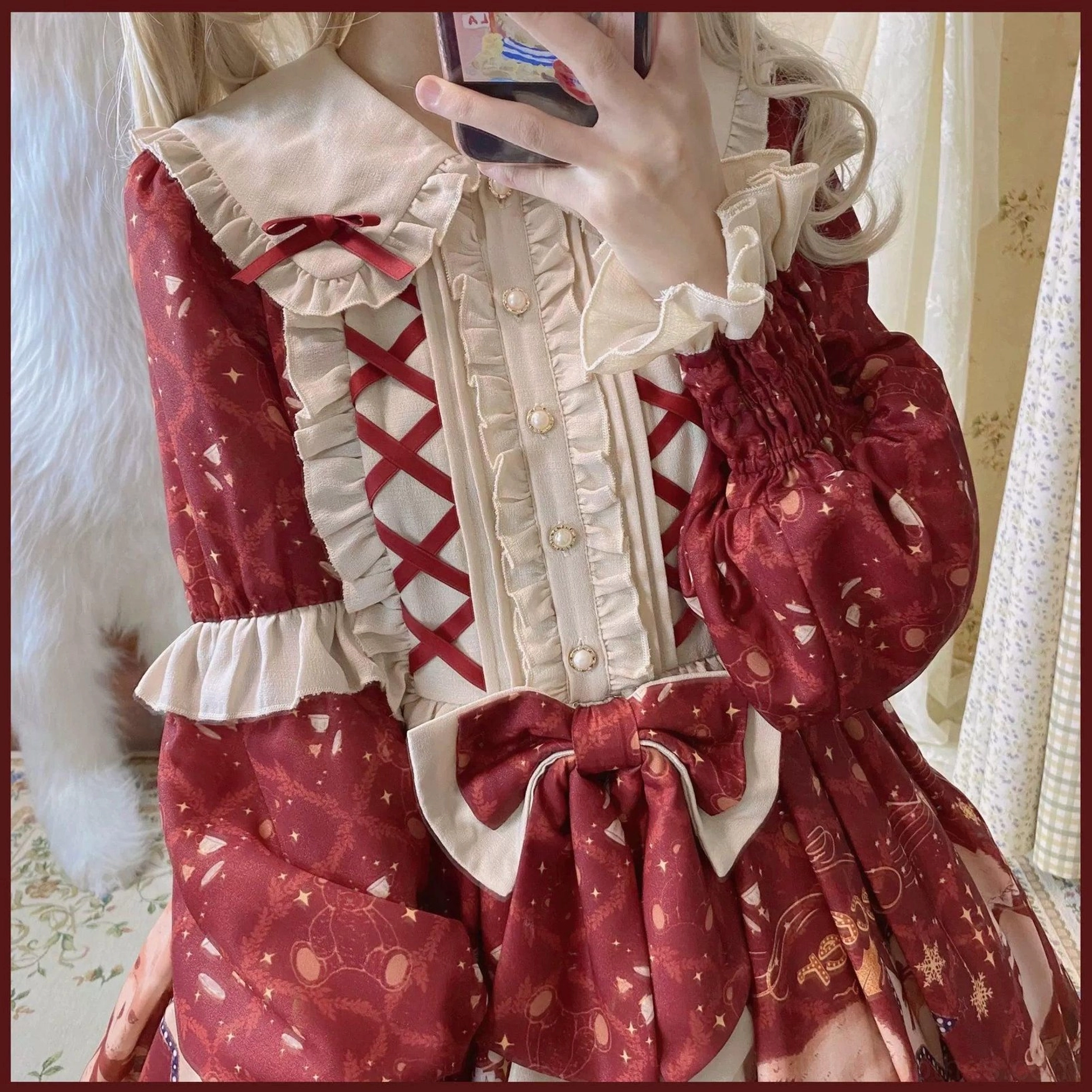 Sweet lolita OP dress upper body close-up showing ruffled Peter Pan collar cross lace bust trim ruffled puff cuffs and wine red fabric with golden dot pattern
